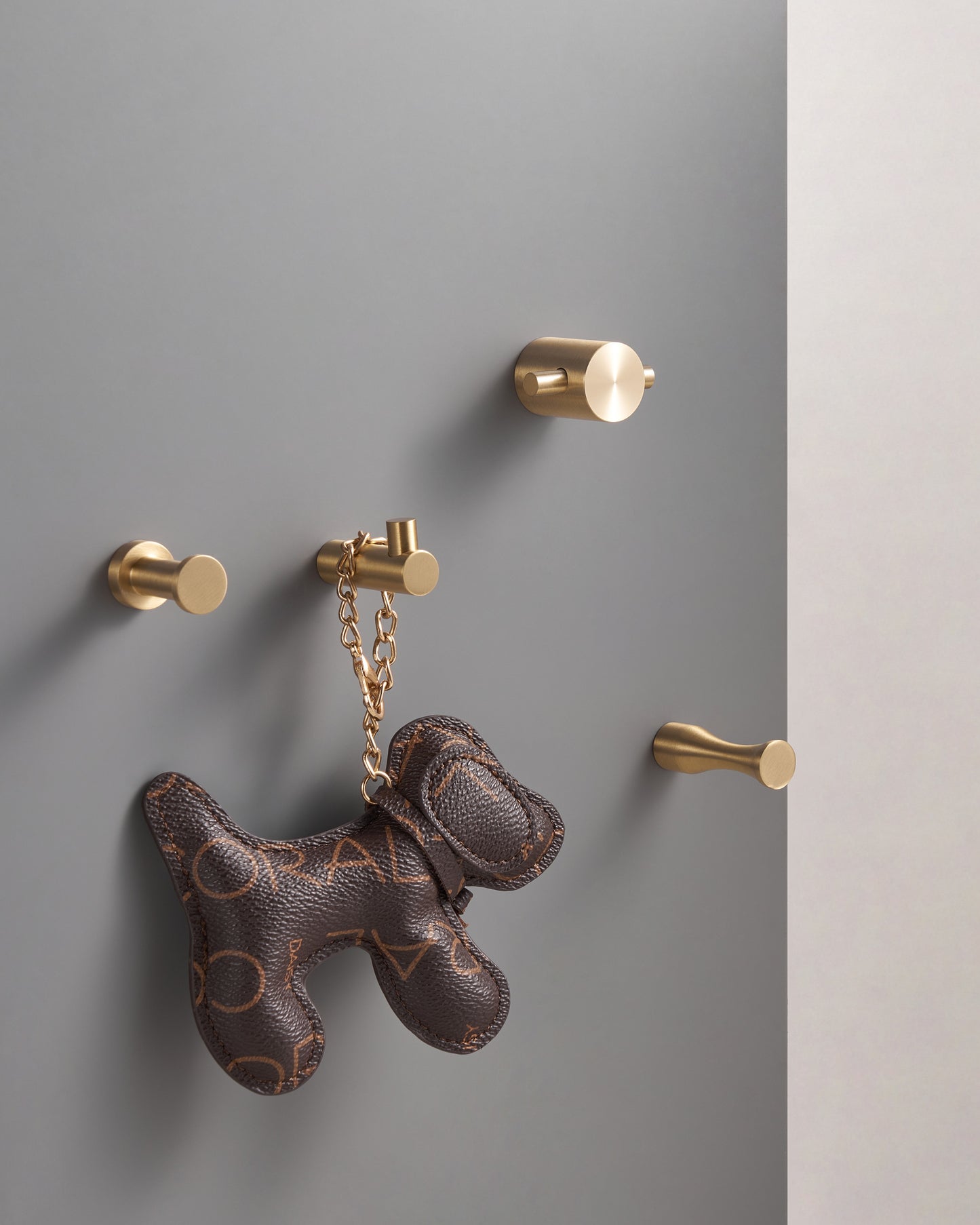 MONACO DECORATIVE HOOKS IN BRUSHED BRASS